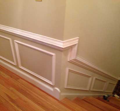 Wainscoting on a wall going along a stair case