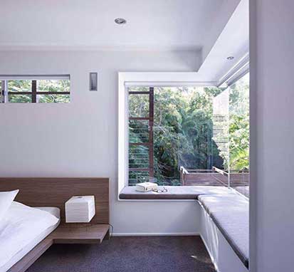 Window seat built into a bedroom of a modern home